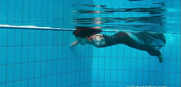  Brunette Nata Szilva strips underwater and gets horny